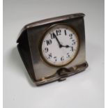 An early 20th century silver cased 8-day jumbo desk watch, with folding travel case, bearing date