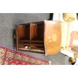 An Edwardian inlaid mahogany revolving library bookcase, with cartouche top and shell coquillage