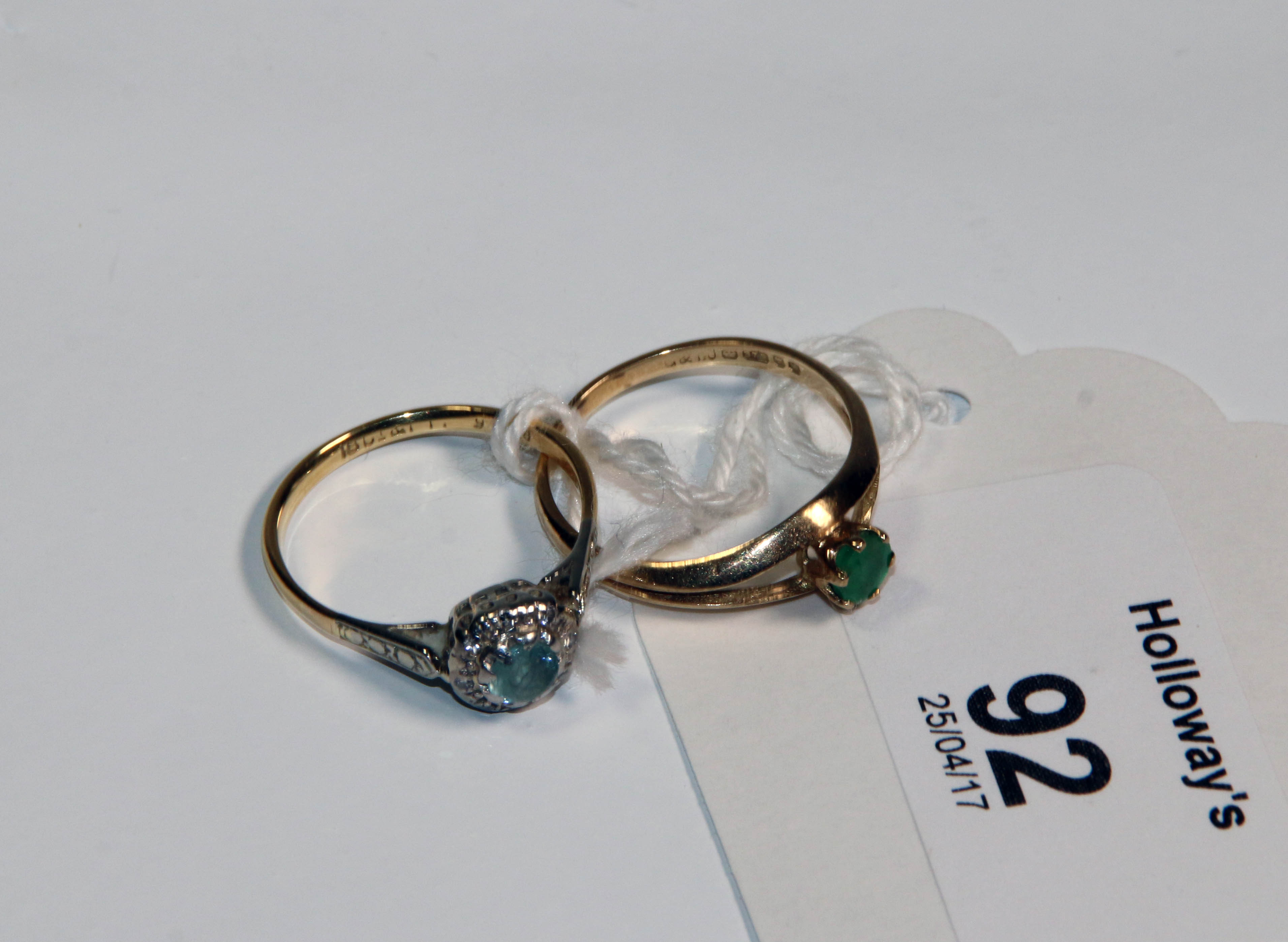 A 9ct gold emerald dress ring, with bifurcated shoulders, together with an 18ct cold and platinum