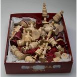 A collection of numerous carved and stained ivory and bone chessmen, of varying design, together