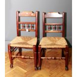 A pair of early 19th century regional/Lancashire side chairs, with profile bobbin back over rush