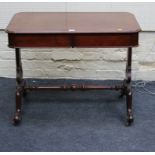 A Victorian mahogany rectangular library table, with radiused corners, fitted two frieze drawers,