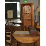 A pine freestanding corner cupboard, together with a pine drop leaf dining table, oak chest of