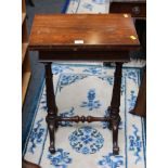 A William IV figured rosewood lady's fold-over work table/card table, raised on spindle supports, 41
