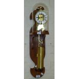 A reproduction skeleton-type bell striking wall clock, with single weight, beneath glass dome