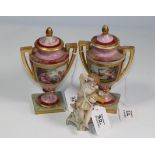 A pair of Vienna porcelain covered urns, and a Continental porcelain figure of a putto