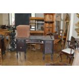 A George IV mahogany concave fronted pedestal sideboard, together with a concave upholstered ottoman