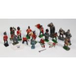 A collection of vintage cast lead toy soldiers, some painted as guardsmen