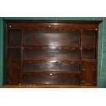 A George III style oak Delft rack, with geometrically moulded cupboards and dentil cornice, 184.