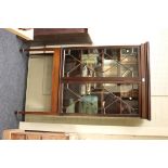 An Edwardian mahogany astragal glazed two door china cabinet, raised on a plain base with square