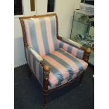 A Regency style fauteuil, with carved show frame and pommel arms