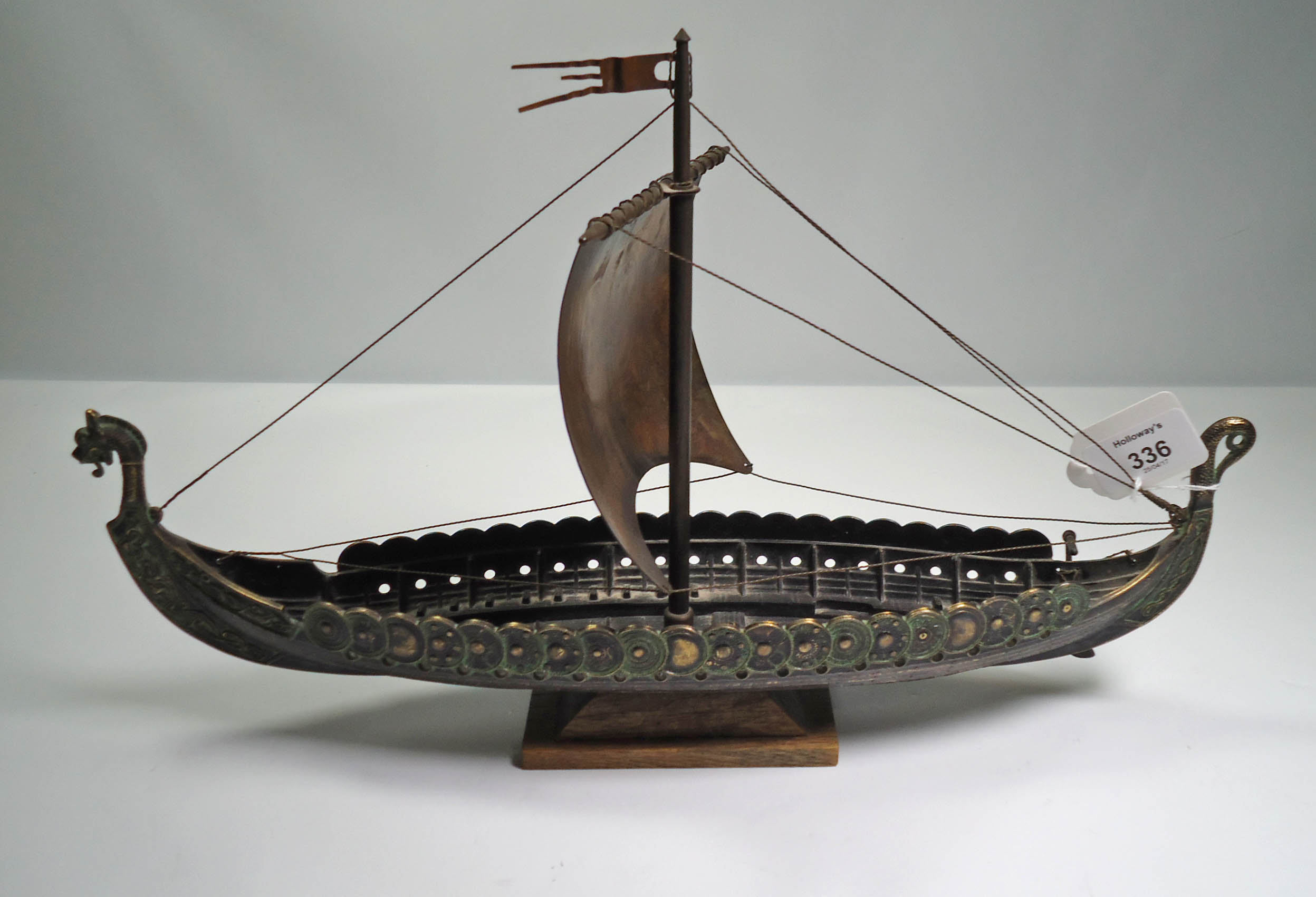 A cast metal model of a Viking longboat