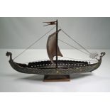 A cast metal model of a Viking longboat