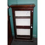 A basically 19th century mahogany and rosewood floorstanding collectors cabinet, the rectangular top