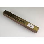 An Edwardian oak, brass and steel mounted spirit level, named J.H. Whitehead, 25.25cm