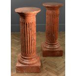 A pair of Scagliola columns, of Doric form, with cyma collars over a square base, 107cm high, 42cm