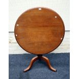 A 19th century mahogany tripod table, the circular snap top with moulded edge on ring turned