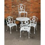 A suite of white painted cast aluminium garden furniture, comprising circular table and four chairs,