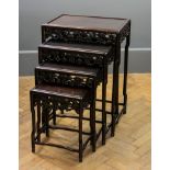 A quartetto nesting set of Chinese rosewood occasional tables, each having a rectangular panel