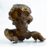 An early 18th century carved lime and gilt gesso winged putto architectural fragment,29 x 27cm