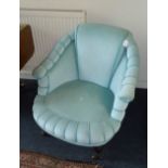 A Victorian deep upholstered low tub chair, with mint coloured covering