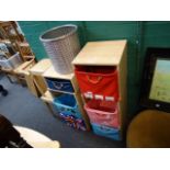 A set of children's storage units, woven cane basket, and two stools