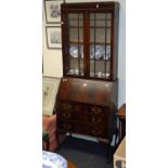 An early 20th century mahogany bureau bookcase