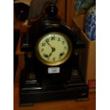 An American black Japanned iron mantel clock