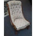 A Victorian, later floral button upholstered salon chair, with serpentine overstuffed seat, on