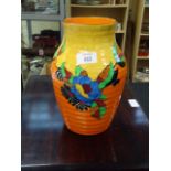 A 1930s style Wilkinson's pottery baluster vase, painted with flowers in the style of Clarice Cliff