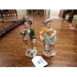 A pair of early 20th century Sitzendorf porcelain figures, of 'The Gardner and his Wife', 11cm high