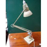 A circa 1950s Anglepoise desk lamp, painted in desert khaki on stepped square base