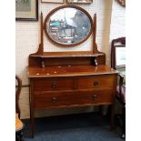 An Edwardian inlaid mahogany swing mirror backed dressing table