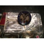 A chrome and enamel Royal Air Forces Association car badge, a signed RAF notepaper by Leslie Howard,