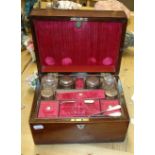 A rosewood toilet case and contents