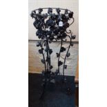 A wrought iron jardiniere stand