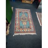 Five machine woven wool rugs, of Middle Eastern design