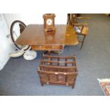 A 19th century mahogany drop leaf table, with frieze drawer opposed by false, on turned column,