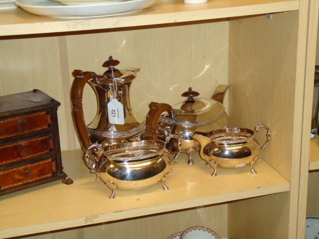 A 20th century silver plated four piece tea set. with hard wood handles and knops