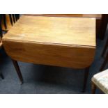 An early 19th century mahogany drop flap Pembroke table, having a rectangular top over end drawer