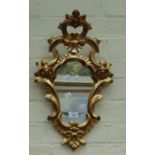 A small Rococo-type giltwood wall mirror