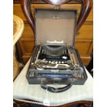 An early 20th century Corona number 3 folding typewriter, in a period hinged case