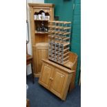 A pine floor standing corner cupboard, a pine wall mounting two door cupboard, a set of pine open