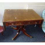 A late Regency mahogany sofa table, the rosewood crossbanded rectangular top and twin flaps with