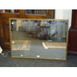 A gilt framed wall mirror