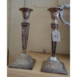 A pair of Indian white metal table candlesticks