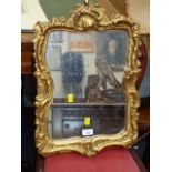 A gilt composite wall mirror