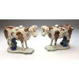 A pair of 19th century, possibly Scottish, pottery cow and milk maid creamers, with ochre, mid