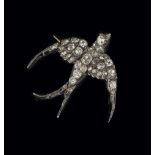 A late Victorian diamond swallow brooch, set throughout with mixed old cut and rose cut diamonds,
