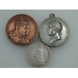 An 1888 Victorian silver crown, an 1821 Geo. IV Coronation medallion and a medallion commemorating